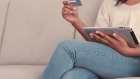 woman using tablet pc to shop