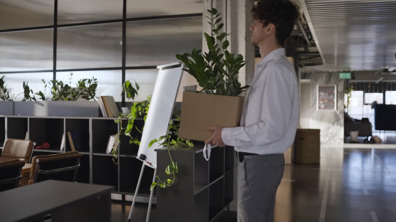 Man Leaving the Office with a Cardboard Box