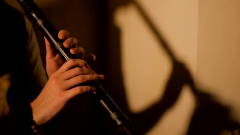 man playing japanese bamboo flute - shakuhachi