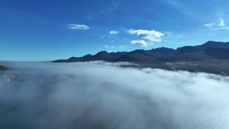 Aerial-View-Over-Low-Clouds-At-Faskrudsfjordur-Fjord-In-East-Iceland---drone-shot