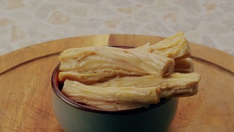 Fermented soy food Fuzhou, Tofu skin yuba sticks or Fuzhu on plate. Healthy asian soy food, Korean and Chinese cuisine.