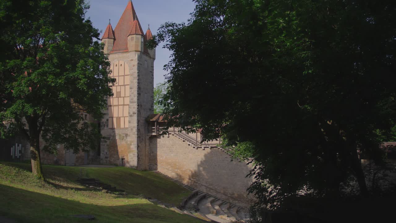 Rothenburg ob der Tauber medieval tower, sunlight, trees, scenic view of fortification