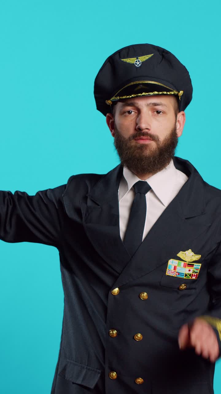 Vertical video: Professional aviator showing thumbs down sign