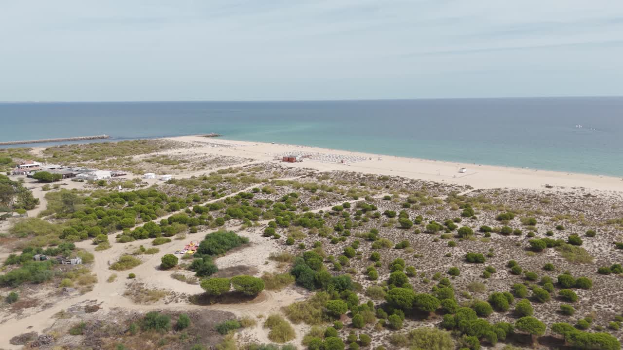 Scenic view over Tavira Island’s coastline, capturing pristine beache and clear blue ocean under the Algarve sun