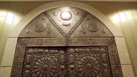 ornate islamic doors in a grand hall