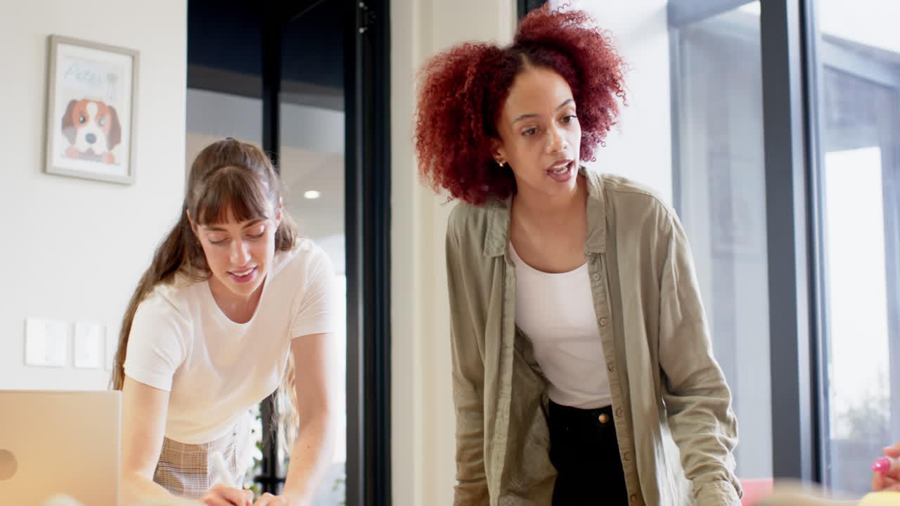 Leading brainstorming session, woman engaging colleagues in creative business writing