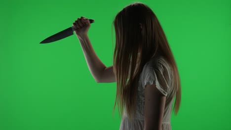 medium side view green screen chroma key video of a posessed female figure ghost poltergeist zombie