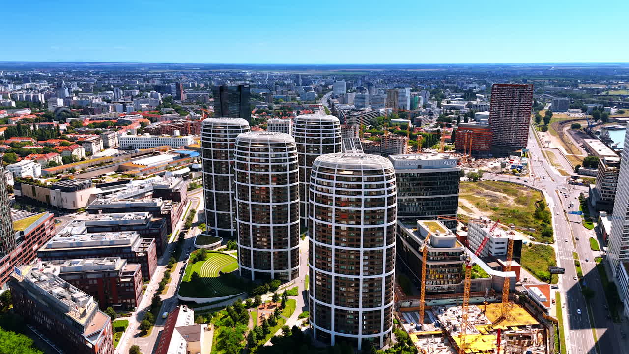 Bratislava, Slovakia - June 14, 2025: Bratislava's modern architecture. High-rise buildings showcase contemporary design in Bratislava, blending urban life with green spaces under a clear sky