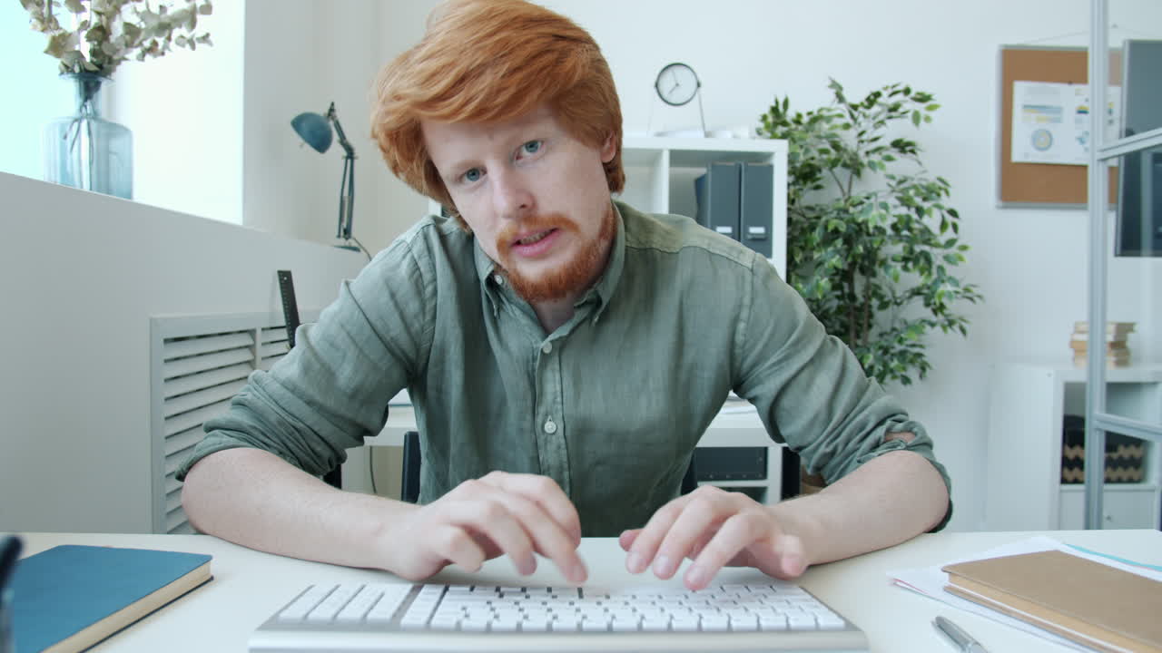 Man Typing on Keyboard in Office