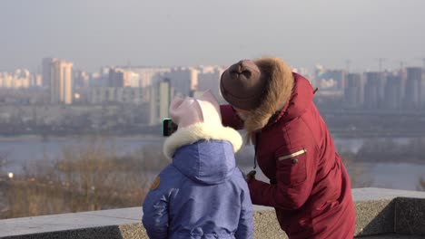 mother daughter on top of the roof in autumn