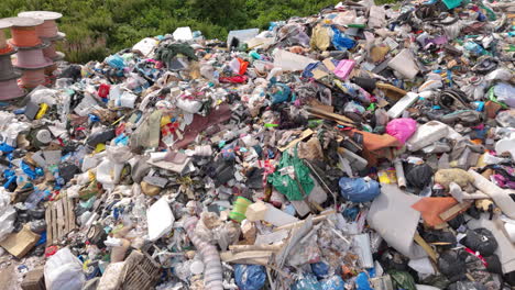 aerial view of towering trash mountain at landfill bound for incineration