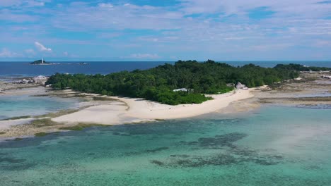 wide aerial of ocean receding from a private