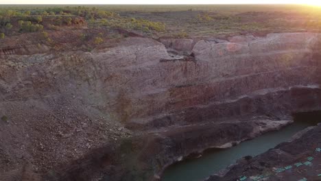 flying over an abandoned, open-pit gold mine in outback australia