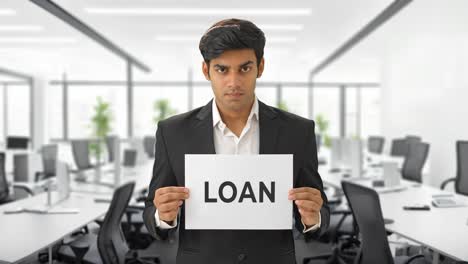 angry indian manager holding loan banner