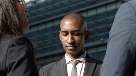 young business people discussing on street