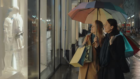 Female-Friends-in-Front-of-Shop-Show-Window