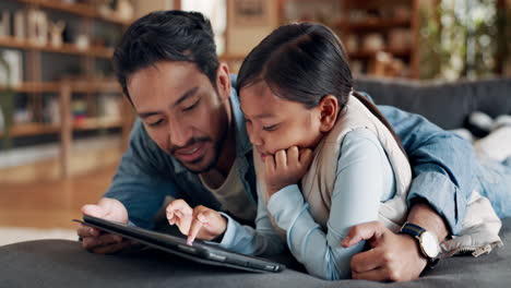 father, tablet and happy kid in home living room