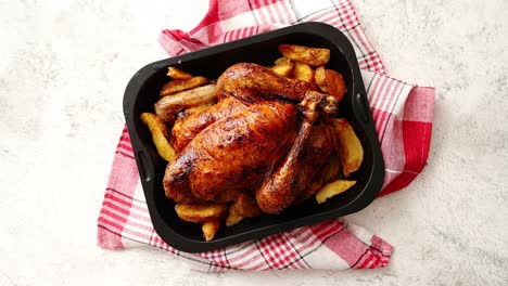 Roasted-chicken-or-turkey-with-potatoes-in-black-steel-mold