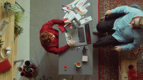 Time-Lapse-of-Female-Fashion-Designer-Working-at-Office-Desk