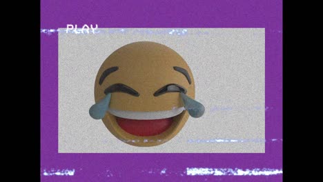 animación digital de vhs efecto de fallo sobre el emoji de la cara riendo sobre un fondo púrpura