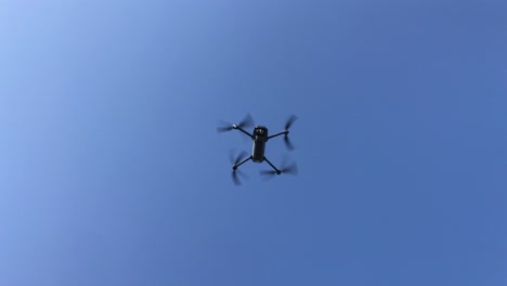 agriculture. innovations. smart technological drone analyzing field flying against sunny sunset sky landscape. digital device