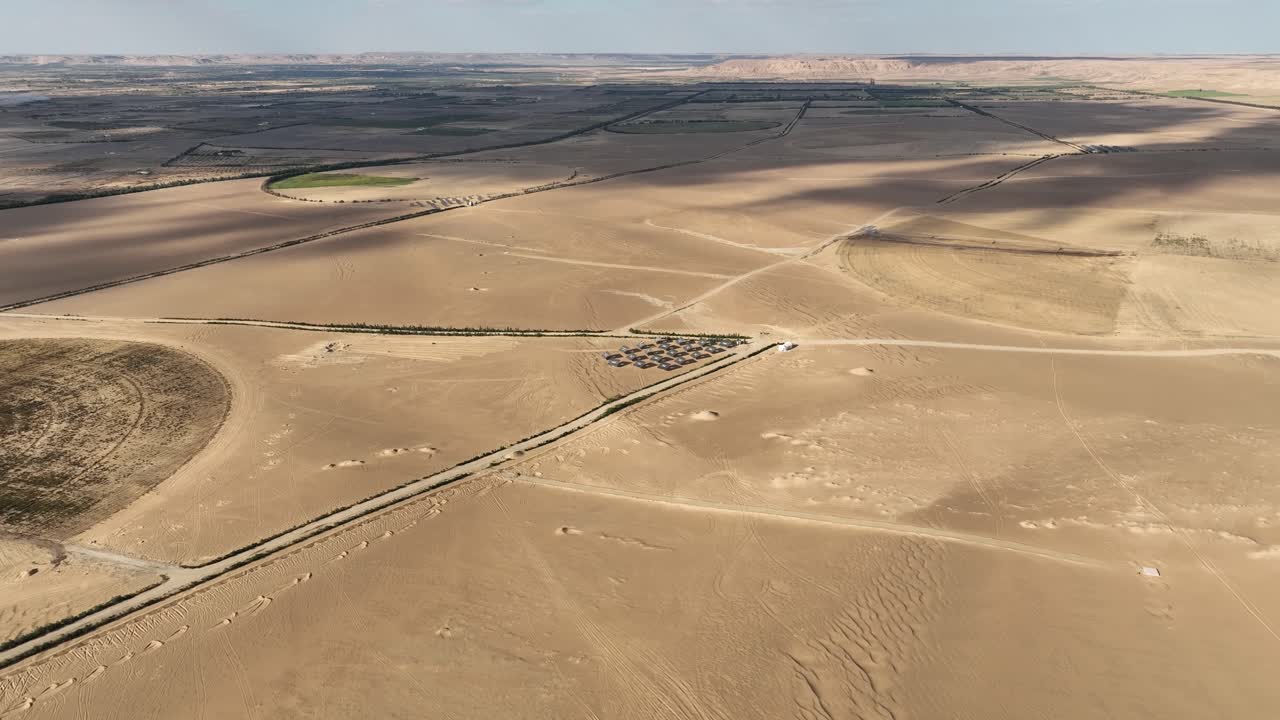 Panoramic View: Bavet Amid Desert Landscapes and Circular Green Irrigation Patches