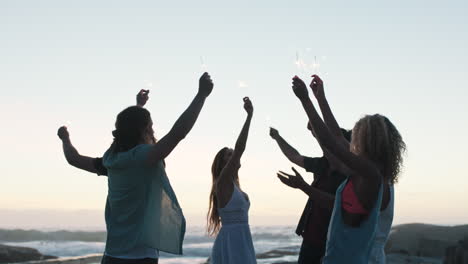 Friends-group,-beach-and-sparklers