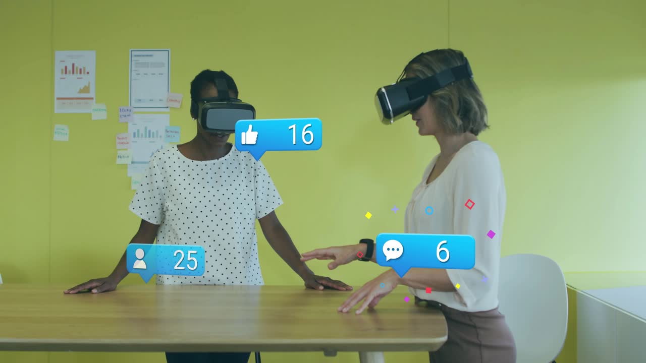 Two tech coworkers with VR headsets extending hand testing social media interface animating icons