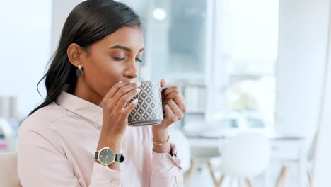 young business woman drinking a calming