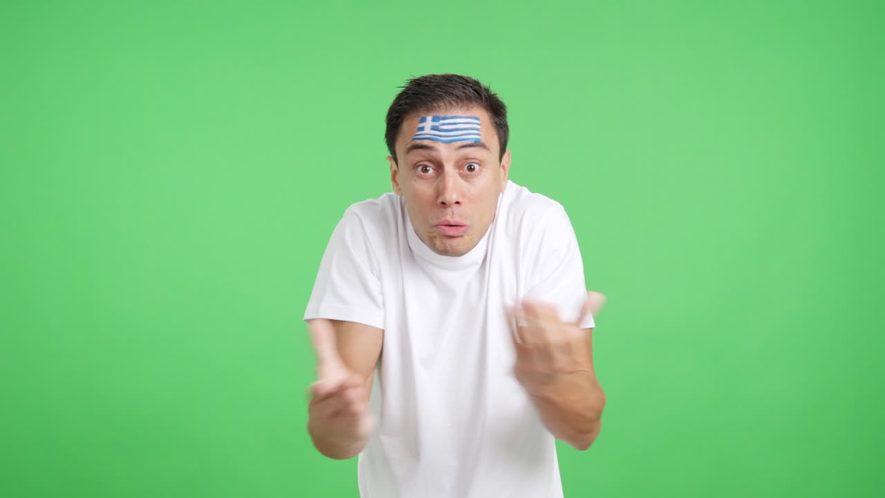 Man Cheering for Greece, angry with the decision of referee