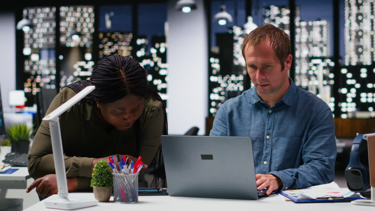 Multiethnic business workers projecting numbers for market research