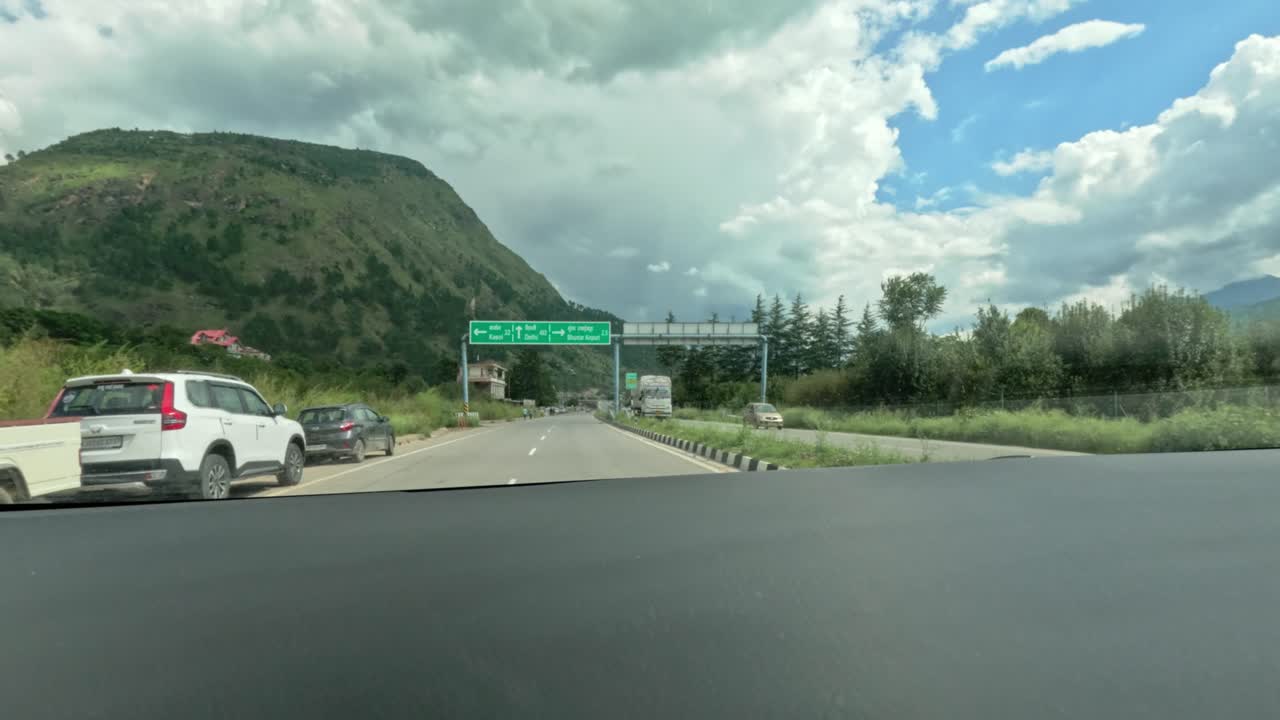 Dashboard time lapse view of travel on road from Manali to Chandigarh