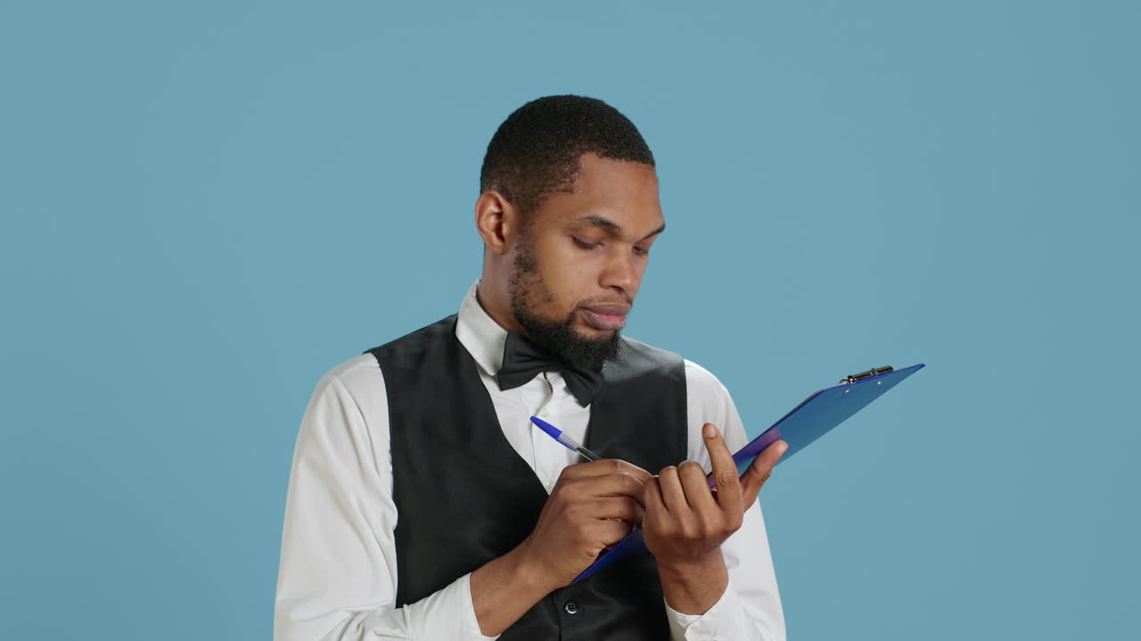 Receptionist worker writing down notes on clipboard files