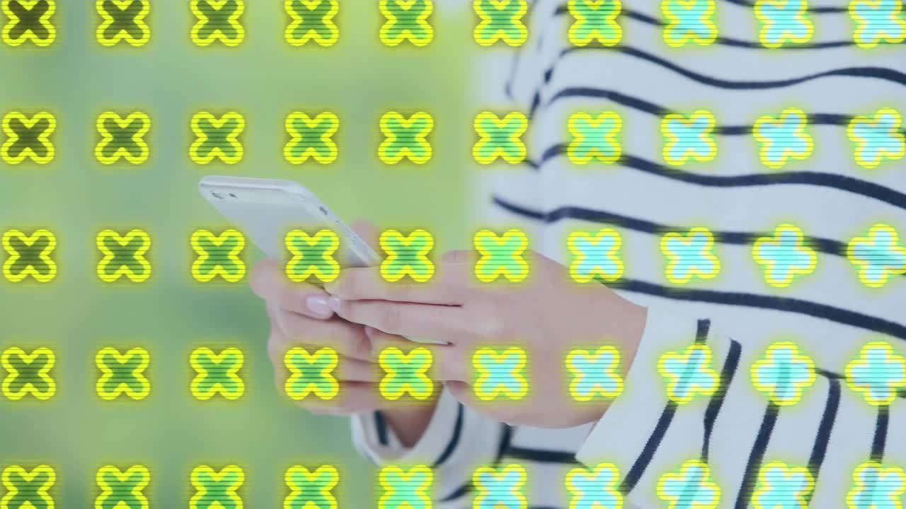 Animation of shapes over caucasian woman using smartphone