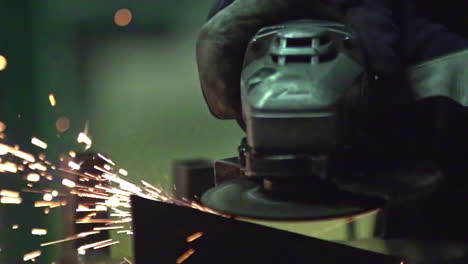 Sandpaper-or-industrial-mechanical-saw-working-and-giving-off-sparks