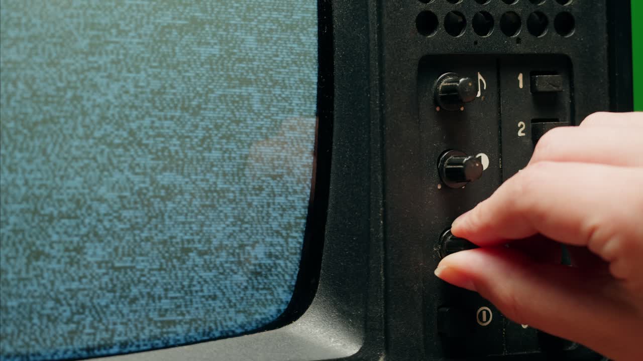 Retro Style TV Set with Green Screen chroma key background, vintage 60s analog television with grain and noise.