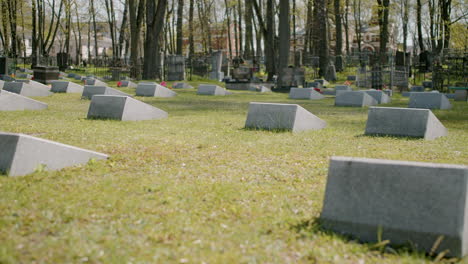 Zoom-In-Of-A-Graveyard-With-Tombstones-In-An-Urban-Area-On-A-Sunny-Day-3