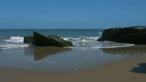 strong tidal waves hitting the shores of britas bay beach wicklow ireland