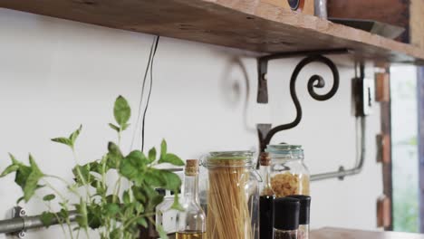 Close-up-of-kitchen-with-pasta-on-worktop-at-sunny-home,-slow-motion