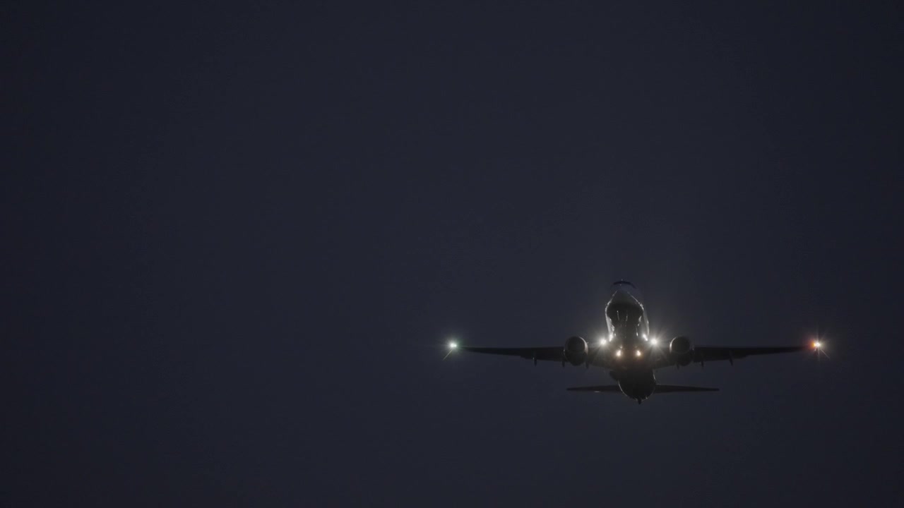 Aircraft taking off from an airport at night