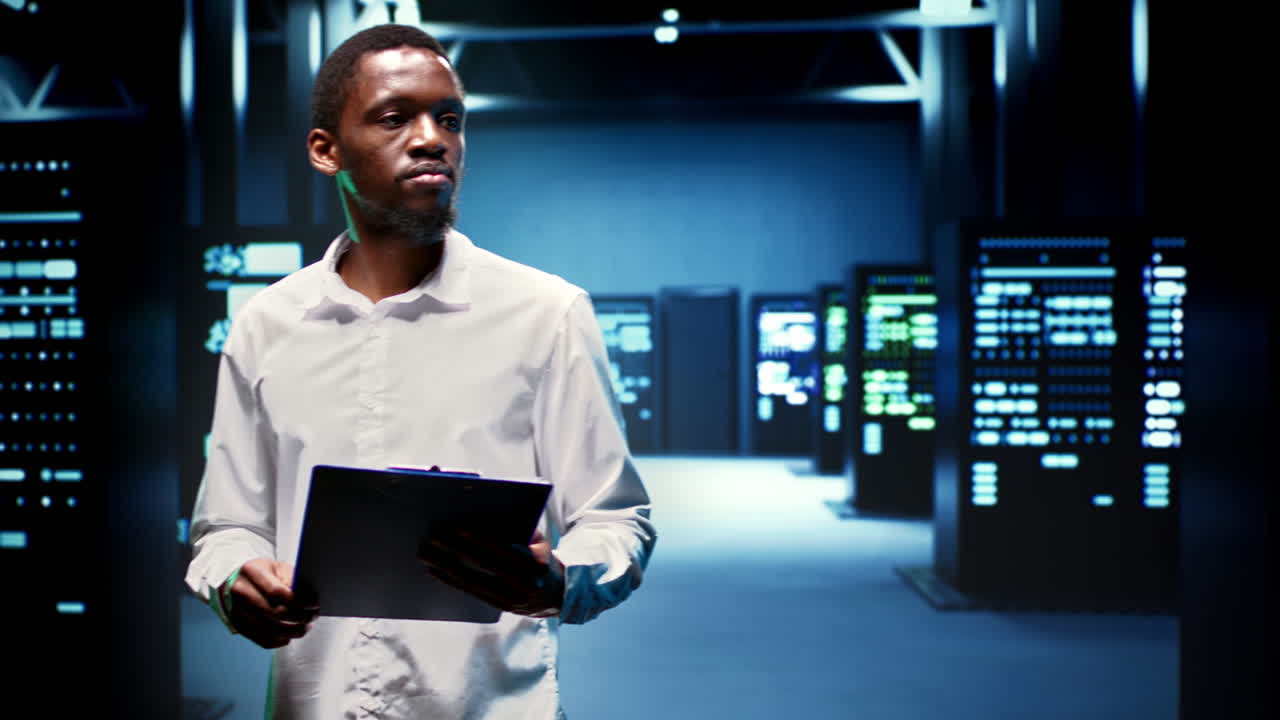 Engineer in data center housing servers