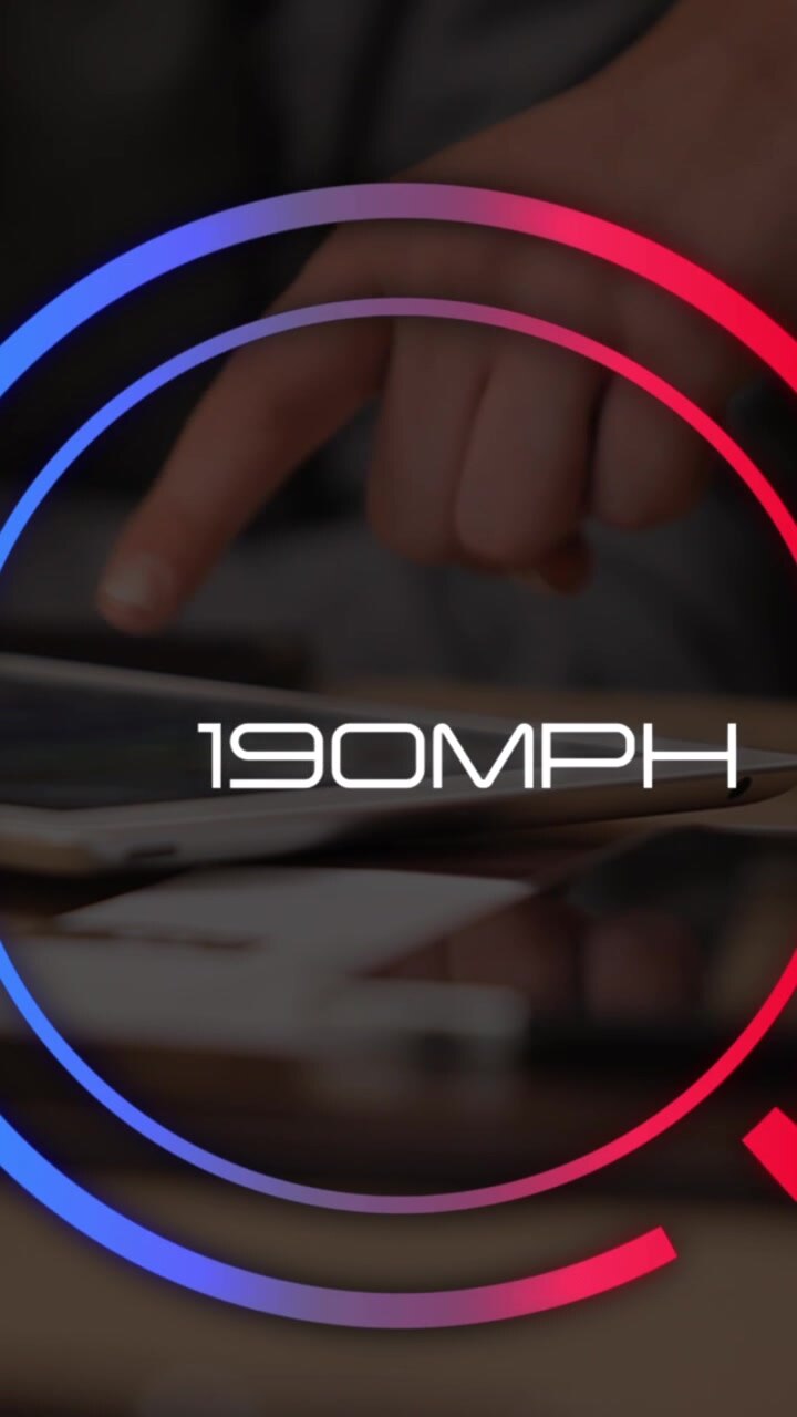 Animation of speedometer over hands of man using tablet