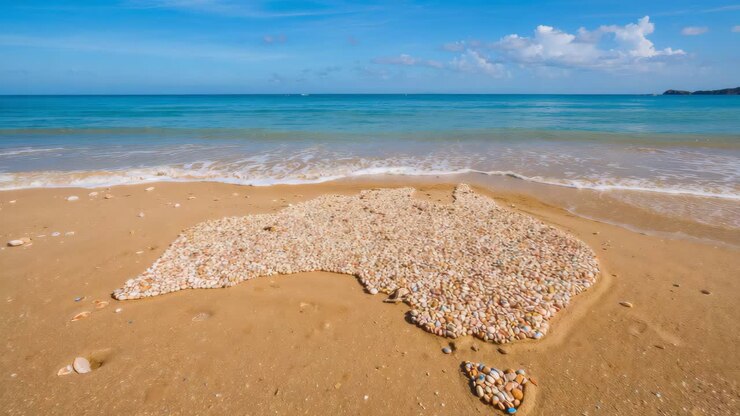Australia shaped with stones on the beach