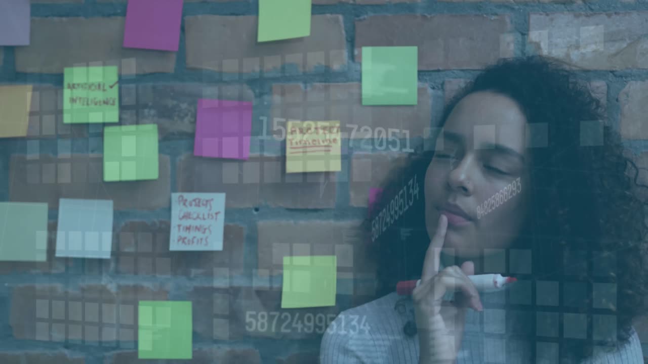 Animation of data processing over african american businesswoman working at office