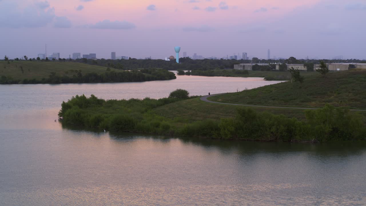 Establishing Aerial Shot of Bayou in Houston with Downtown Skyline Behind
