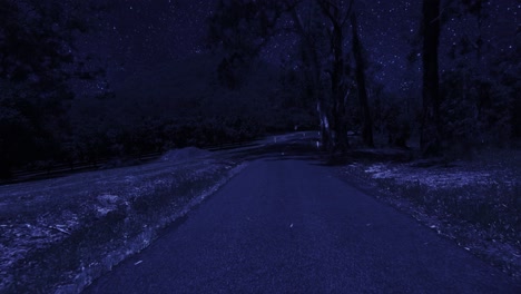 rear facing night driving point of view pov for interior car scene green screen replacement - night under a clear starry sky, on quiet deserted country roads, with ominous mountain in background