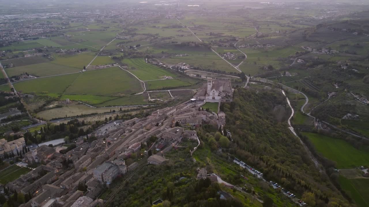 Aerial view of Saint Francesco's basilica, Umbria, Italy, sunset, 4k