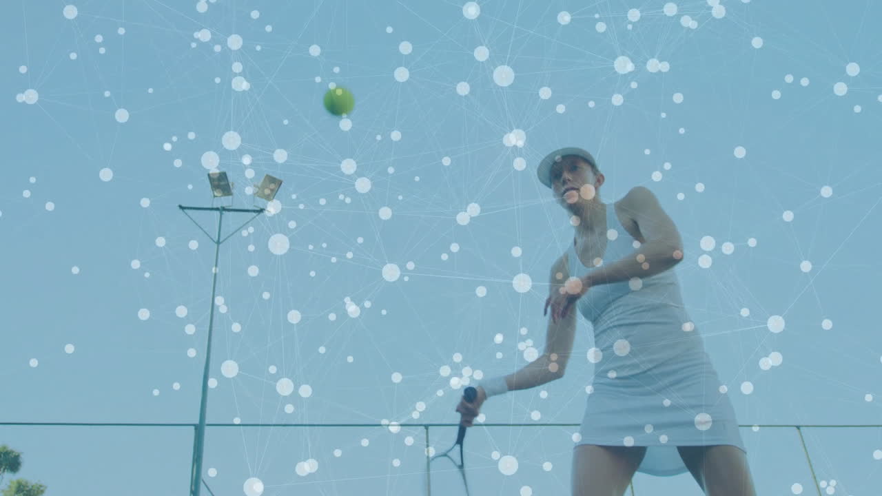 Female tennis player swinging racket on outdoor tennis court, with technology network overlay
