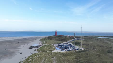 aerial view of a lighthouse on a sandy beach