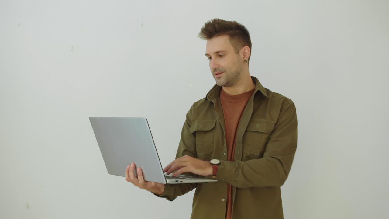 Portrait of Caucasian Developer with Laptop Isolated on White Background